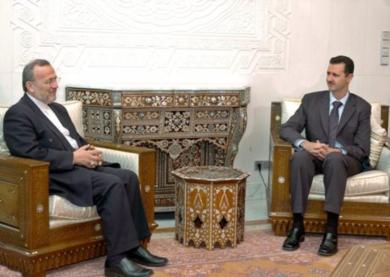 الرئيس السوري بشار الاسد مع وزير الخارجية الايراني منوشهر متقي 