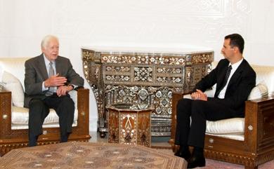 الرئيس السوري بشار الاسد يتحدث الرئيس الاميركي الاسبق جيمي كارتر
