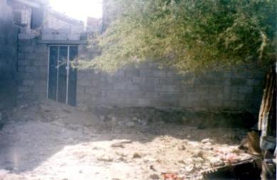 حوش المنزل الذي دفن فيه جثتا المجني عليهما حوش المنزل الذي دفن فيه جثتا المجني عليهما